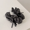 Detailed view of dark grey polka dot banana hair clip with elegant black velvet bow - Banana Clip / Gray