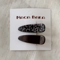 Close-up of leopard print and dark brown hair clip set on a white display card - Triangle Style