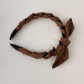 Detailed view of brown polka dot bow headband with non-slip inner plastic teeth - Headband / Brown