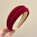 Detail of burgundy velvet headband showing thick texture and non-slip inner lining - Red