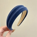 Detail of navy blue velvet padded headband showing soft texture and non-slip lining - Blue