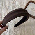 Detail of wide thick dark brown headband with textured knit fabric and padded foam - Brown