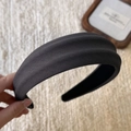 Detail of black thick headband showing premium twill fabric texture and matte finish - Gray
