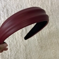 Detail of wine red PU leather headband with thick padding and non-slip inner velvet lining - Red