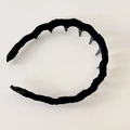 Detail view of the twisted black velvet headband featuring anti-slip inner plastic teeth - Navy Blue