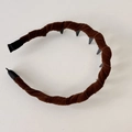 Detailed macro view of brown velvet headband featuring internal non-slip plastic teeth - Brown