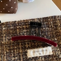 Elegant burgundy velvet hair claw clip on textured tweed fabric for autumn winter style - Red