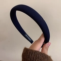 Detail of navy blue padded headband with handmade fabric texture and inner tag - Navy Blue