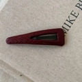 Detail view of burgundy faux leather triangle hair clip with lychee grain texture - Red Slim Triangle Style