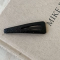 Detailed view of black teardrop BB hair clip with premium lychee faux leather texture - Black Slim Triangle Style
