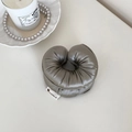 Soft taupe silk oversized cloud scrunchie with elegant aesthetic lifestyle props - Gray