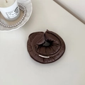 Detailed close-up of dark brown satin scrunchie with cotton-filled soft padding and silk luster - Brown