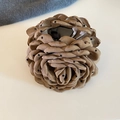 Detailed close-up of a French retro brown polka dot rose flower hair claw clip - Coffee Polka Dot