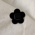 Elegant black five-petal flower acetate hair clip with glossy finish and logo detail - Flower Style / Medium / Black