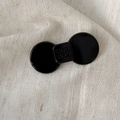 Elegant black acetate bow hair clip with engraved 'wer wer' text on fabric background - Bowknot Style / Medium / Black