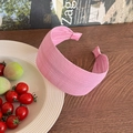 Detail of pink textured wide headband with puckered fabric on a rustic wooden table - Rose Pink