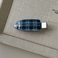 Detail of blue and white checkered resin hair clip with gold glitter and silver metal base - Blue