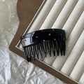Macro detail of 11-prong black acetate hair comb with colorful inlaid rhinestones - Black