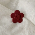 Dark red acetate flower hair clip with engraved square center on beige linen fabric - Flower Style / Small / Retro Copper