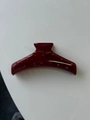 Close-up of wine red acrylic hair claw clip with matching sparkling rhinestones - Dark Red