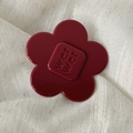 Chic red acetate flower hair clip with WCIWCI letter engraving on white fabric - Flower Style / Large / Retro Copper