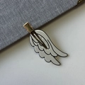 Close-up of white angel wing hair clip featuring black outlines and three sparkling rhinestones - Off-white