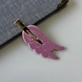 Detailed macro view of pink wing hair clip with rhinestones and gold alligator grip - Rose Pink