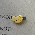 Close-up of yellow polka dot acrylic hair clip with silver metal crocodile grip - Pea Shape / Yellow Pea