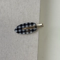 Detail of checkered acetate hair clip with gold metal clasp and handmade lettering - Plaid Style