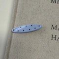 Detail of light blue oval hair claw with brown polka dots on a linen texture background - Blue Oval Hair Clip