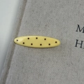 Detail of a vintage yellow oval hair claw clip with dark brown polka dots and glossy finish - Yellow Ellipse Hair Clip