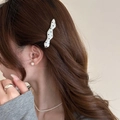 Polka dot pattern hair clip in white and black shown on model in Korean style - Silver Wave Style