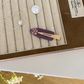 Purple acetate hair clip with moon and star pattern on beige velvet jewelry tray - Purple Moon