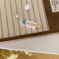 White acetate hair clip with blue rhinestone butterfly design on jewelry tray - White Butterfly