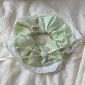 Detail of green plaid scrunchie with white lace trim and handmade ribbon bow - Scrunchie