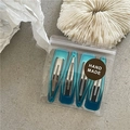 Set of 4 gradient lake blue resin teardrop hair clips with metal base on minimal background - Lake Blue Water Drop