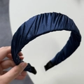 Detail view of dark blue pleated silk headband with non-slip ends for comfort - Navy Blue
