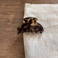 Macro shot of tortoise shell acetate hair claw clip with golden brand engraving - Small / Tortoise