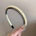 Close-up of yellow woven headband with non-slip inner teeth and protective ends - Yellow