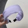 Detail of lavender satin wide headband showing fine stitching and anti-slip black tips - Purple