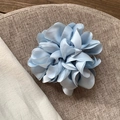 Elegant light blue satin floral hair tie with layered silk petals on linen fabric - Blue