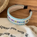 Bohemian wide woven headband with colorful ethnic patterns and blue cross-stitching detail - Blue