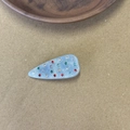Detail of light blue acetate hair clip featuring colorful rhinestones in a water-drop design - Blue