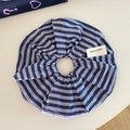 Blue and white striped scrunchie with a handmade tag on an elegant white surface - Blue Stripe