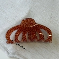 Detail of a brown leopard print acetate hair claw clip on light grey linen background - Brown Spotted