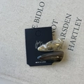 Detail of marble acetate teardrop hair clips on display card with artistic lettering - Gray