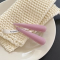 Pair of retro lavender acetate hair clips with glossy finish on a textured background - Soft Pink