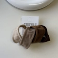 Detailed close-up of 4-pack earth tone elastic hair ties on minimalist card packaging - Coffee Colors