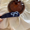 Close-up of dark blue BB clip with light blue 3D bow and Creation France text detail - Teardrop BB Clip Bow Style / Dark Blue