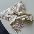 Close-up of floral scrunchie with pink bow ribbon and hand made label detail - Pink Scarf Scrunchie
